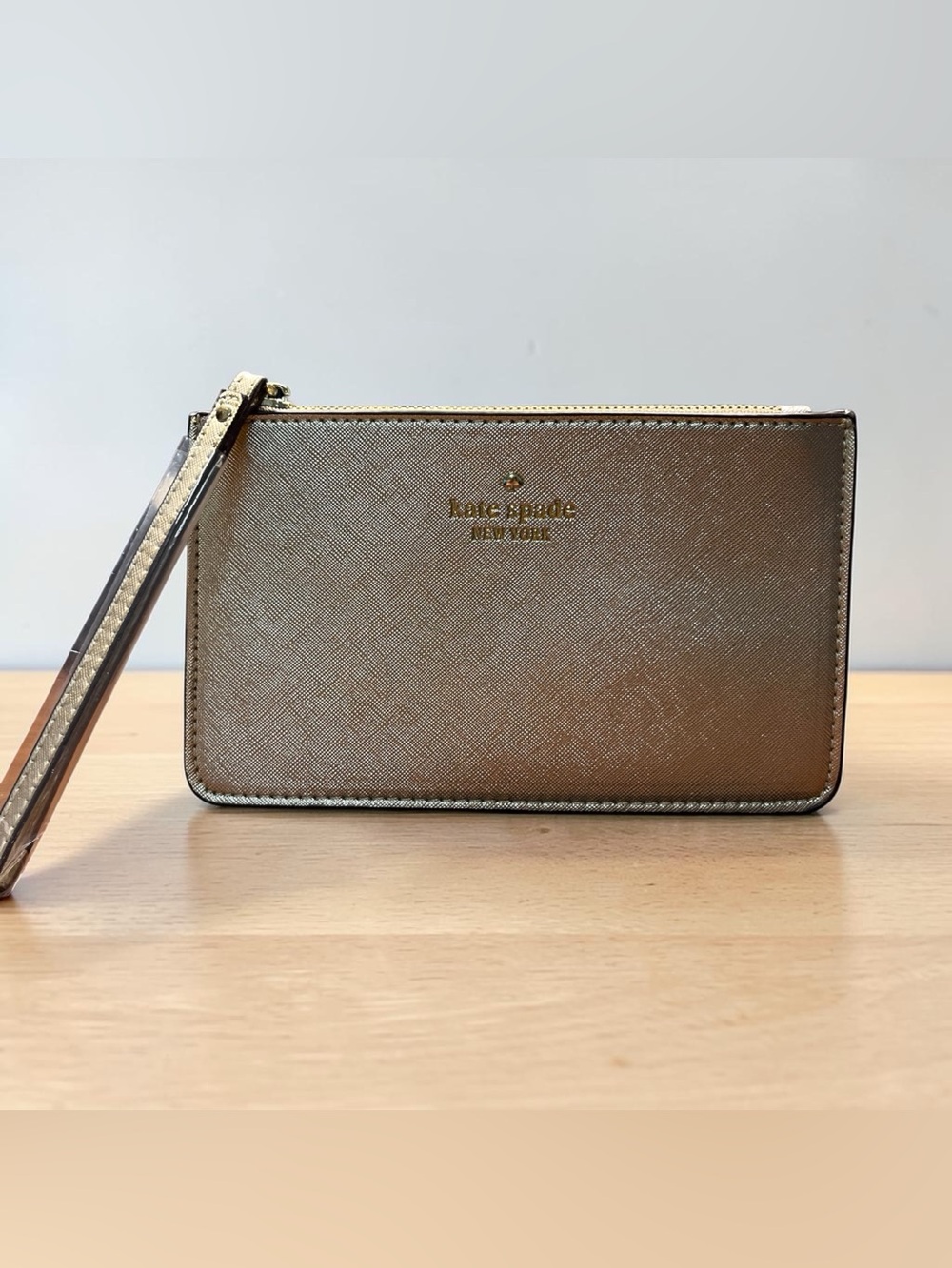 Kate Spade, New York metallic gold wristlet